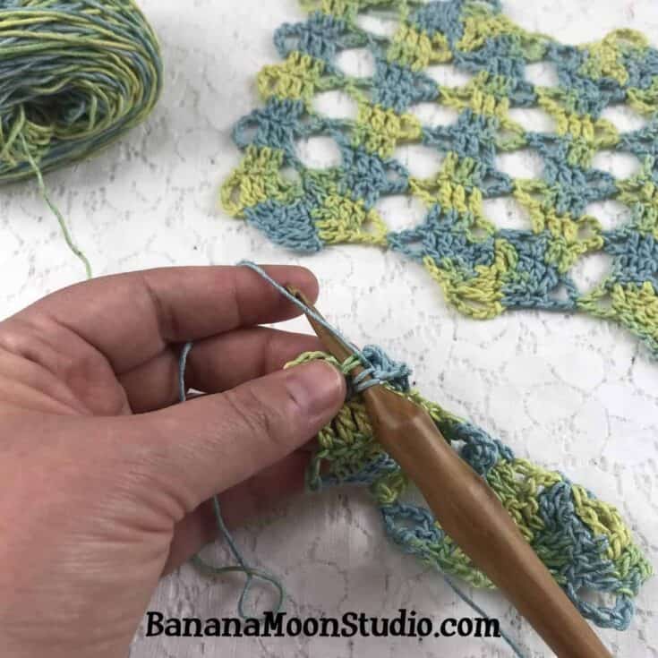 Blue and green swatch in bruges lace.