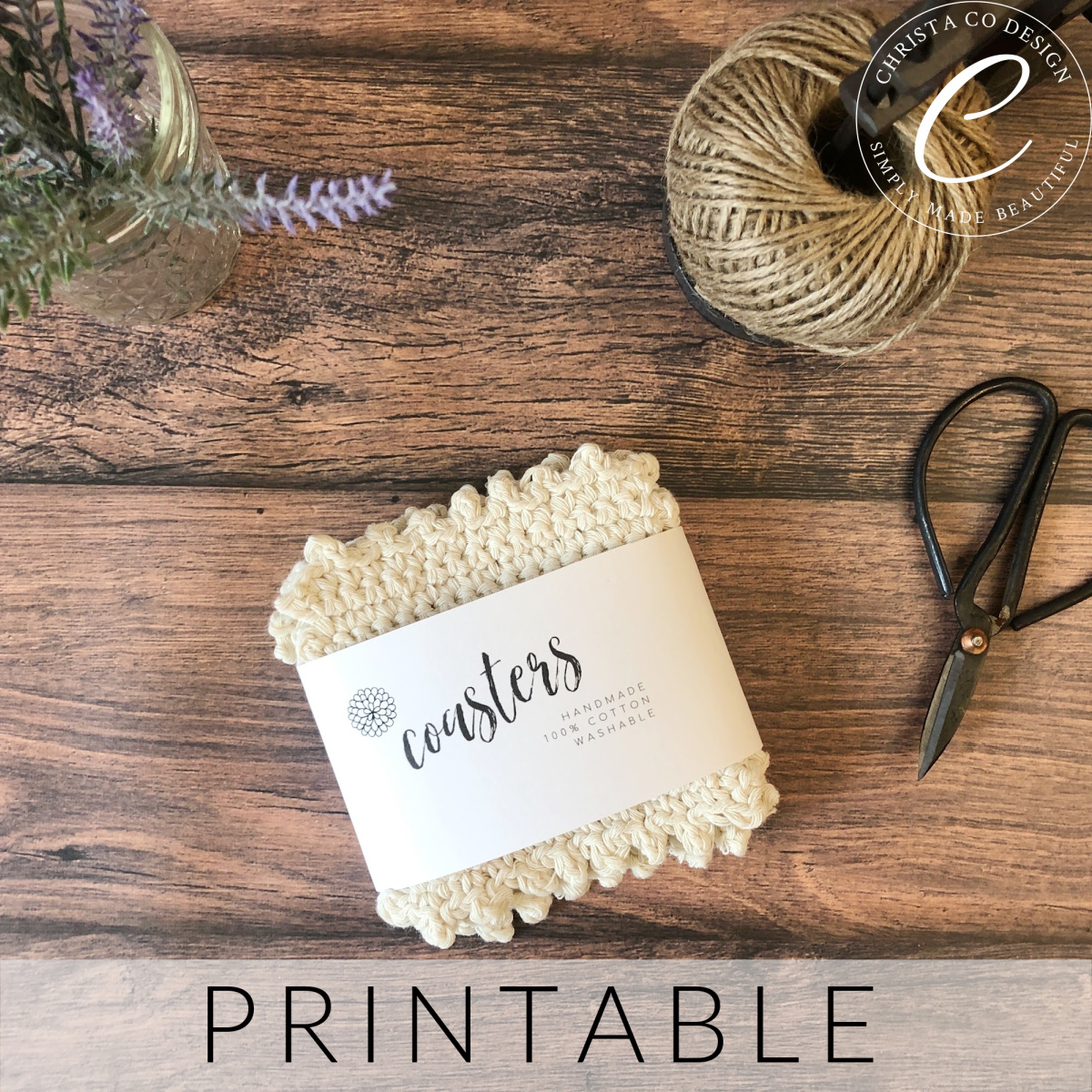 Cream crochet coasters wrapped in label with scissors and twine on wood table.