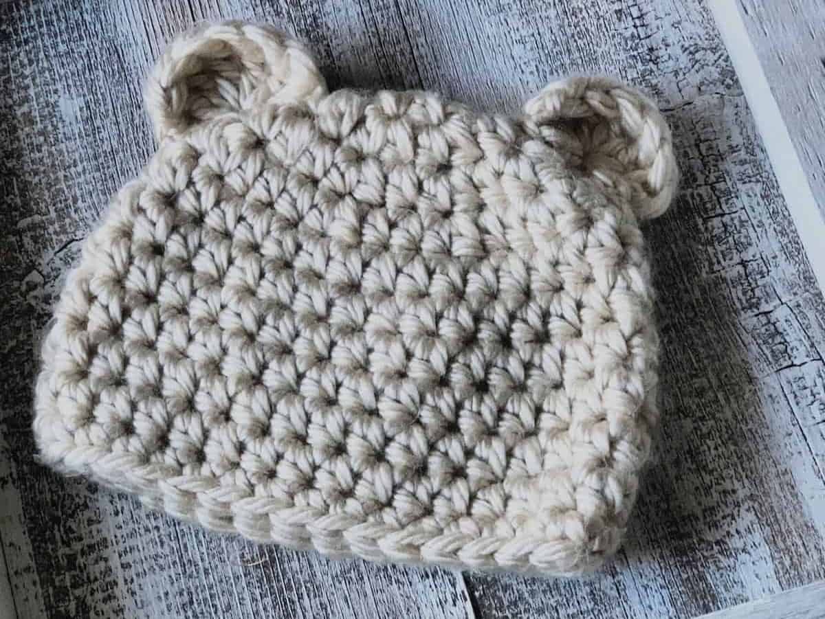 Cream colored crochet bear beanie with ears.