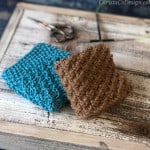 Two knit dishcloths folded into squares.