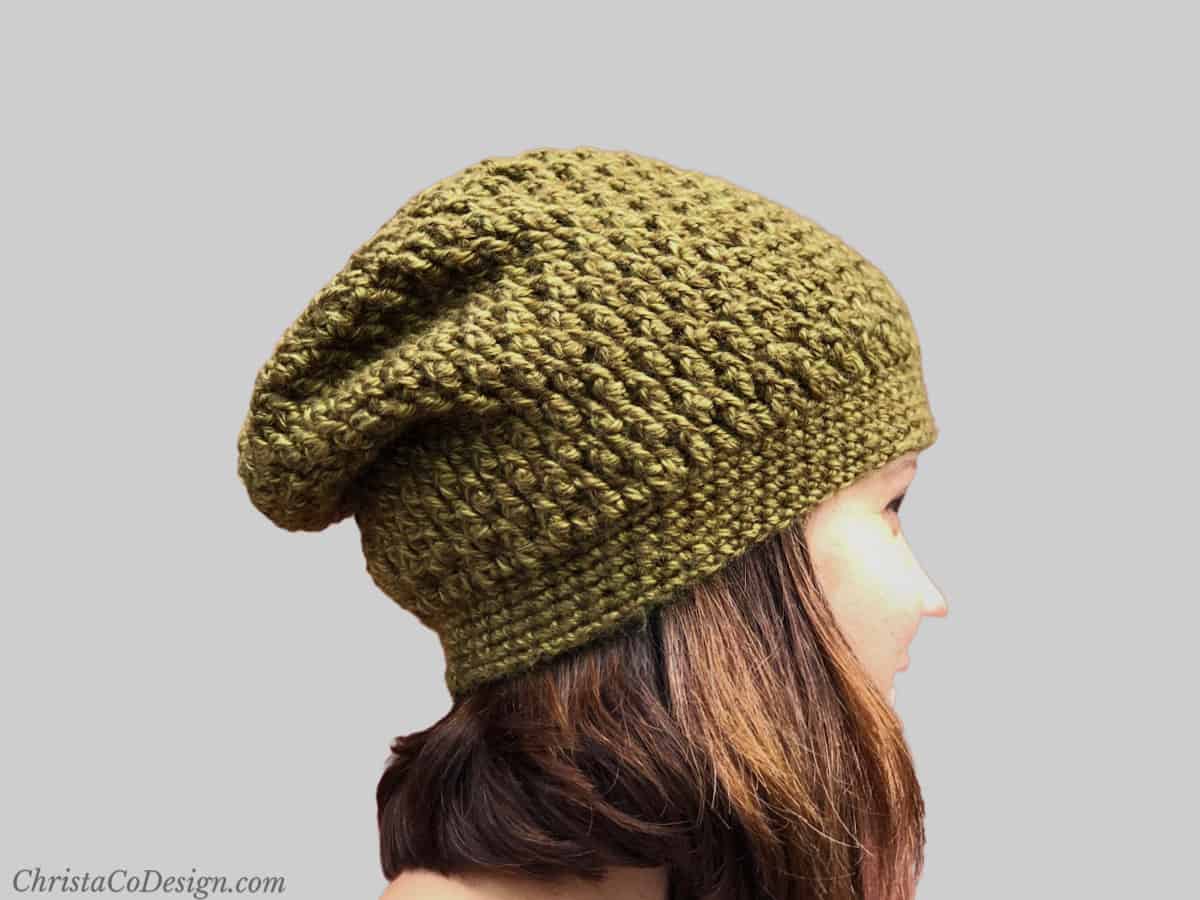 Woman in slouchy crochet hat.