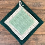 3 square crochet dishcloths stacked in mint, white and teal.