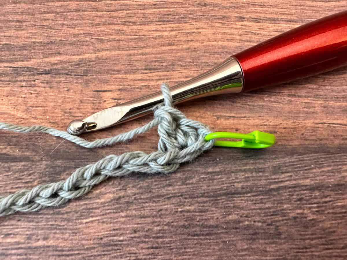 First chain with green stitch marker and hdc and dc in same stitch.
