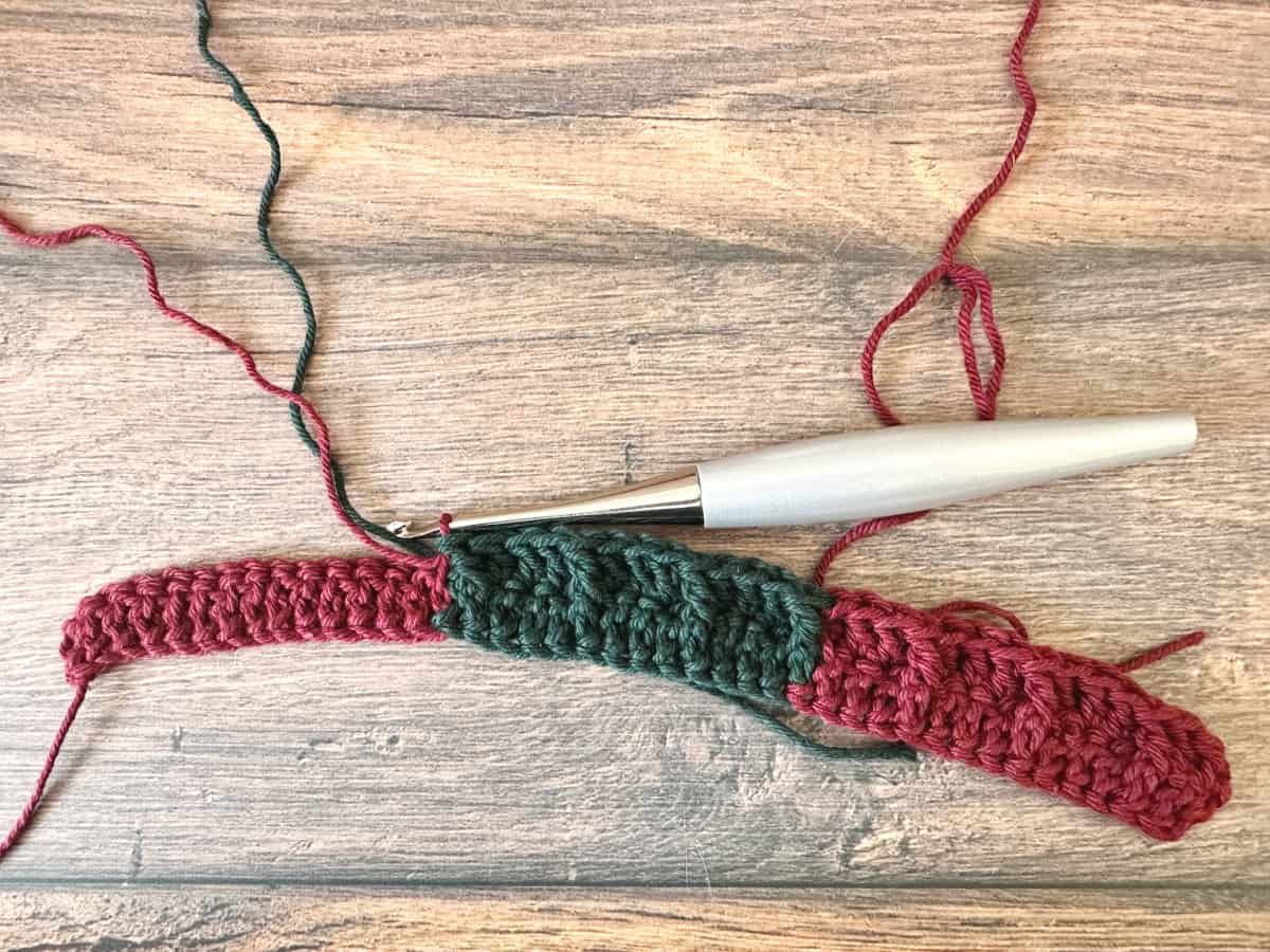Row 2 of waffle stitch in red and green.