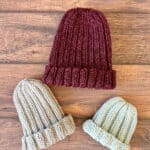 3 ribbed knit beanies in maroon, grey and light blue.