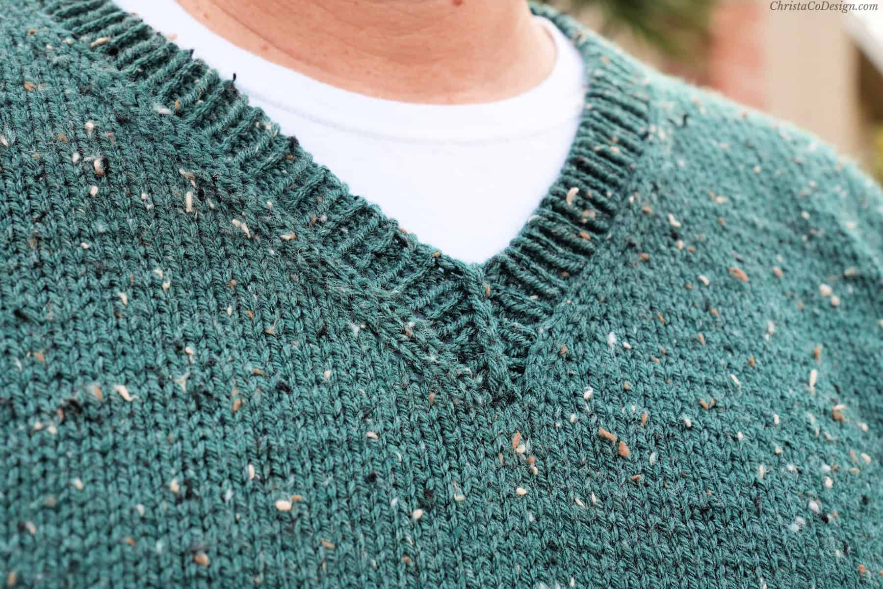 Close up of knit v-neck ribbing.