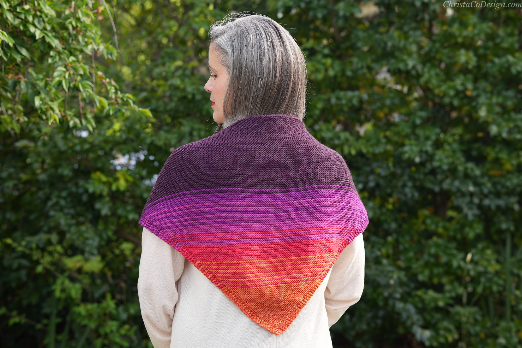 Woman with ombre triangle scarf on back.