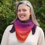 Woman with knit scarf around neck.