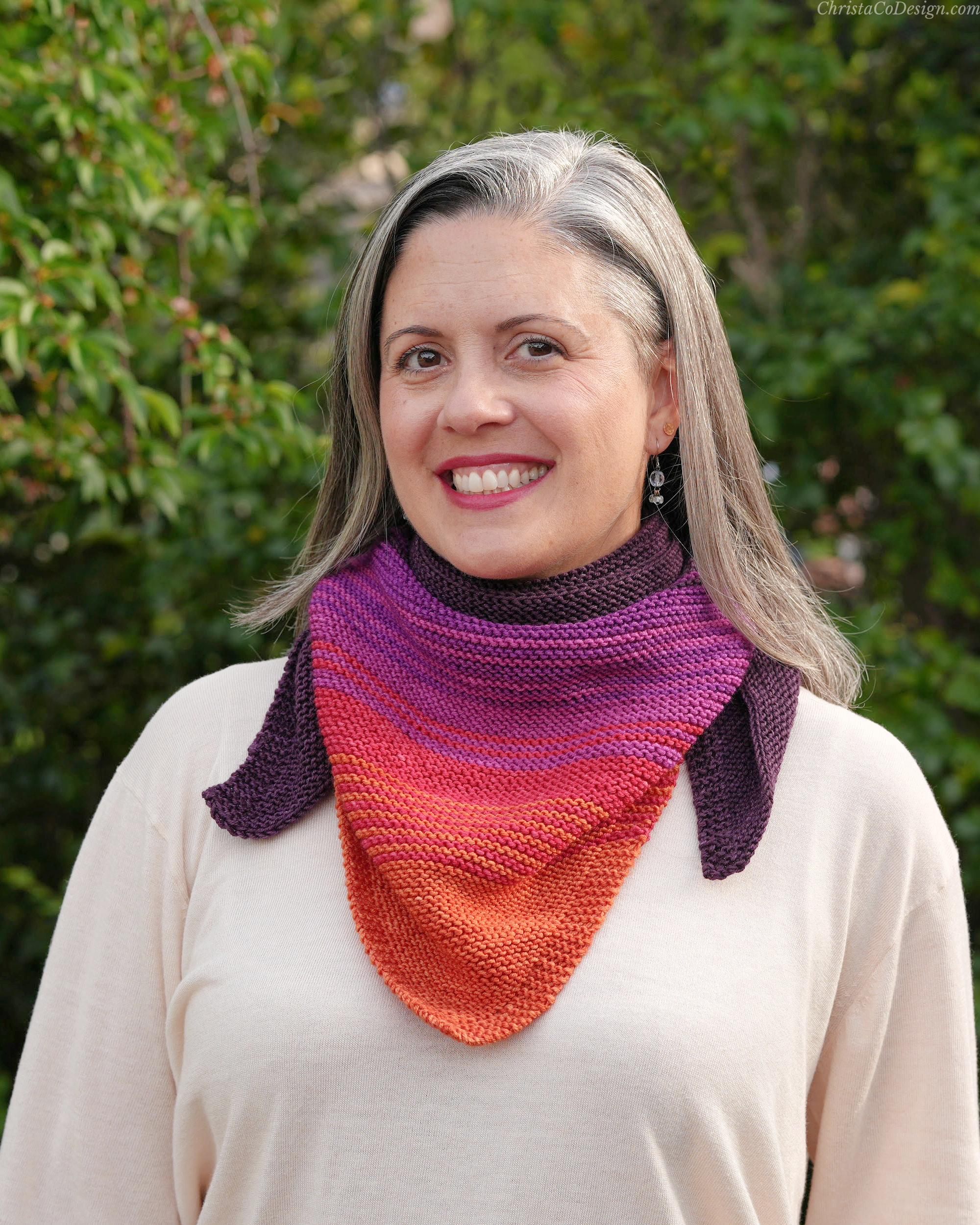 Woman with knit scarf around neck.