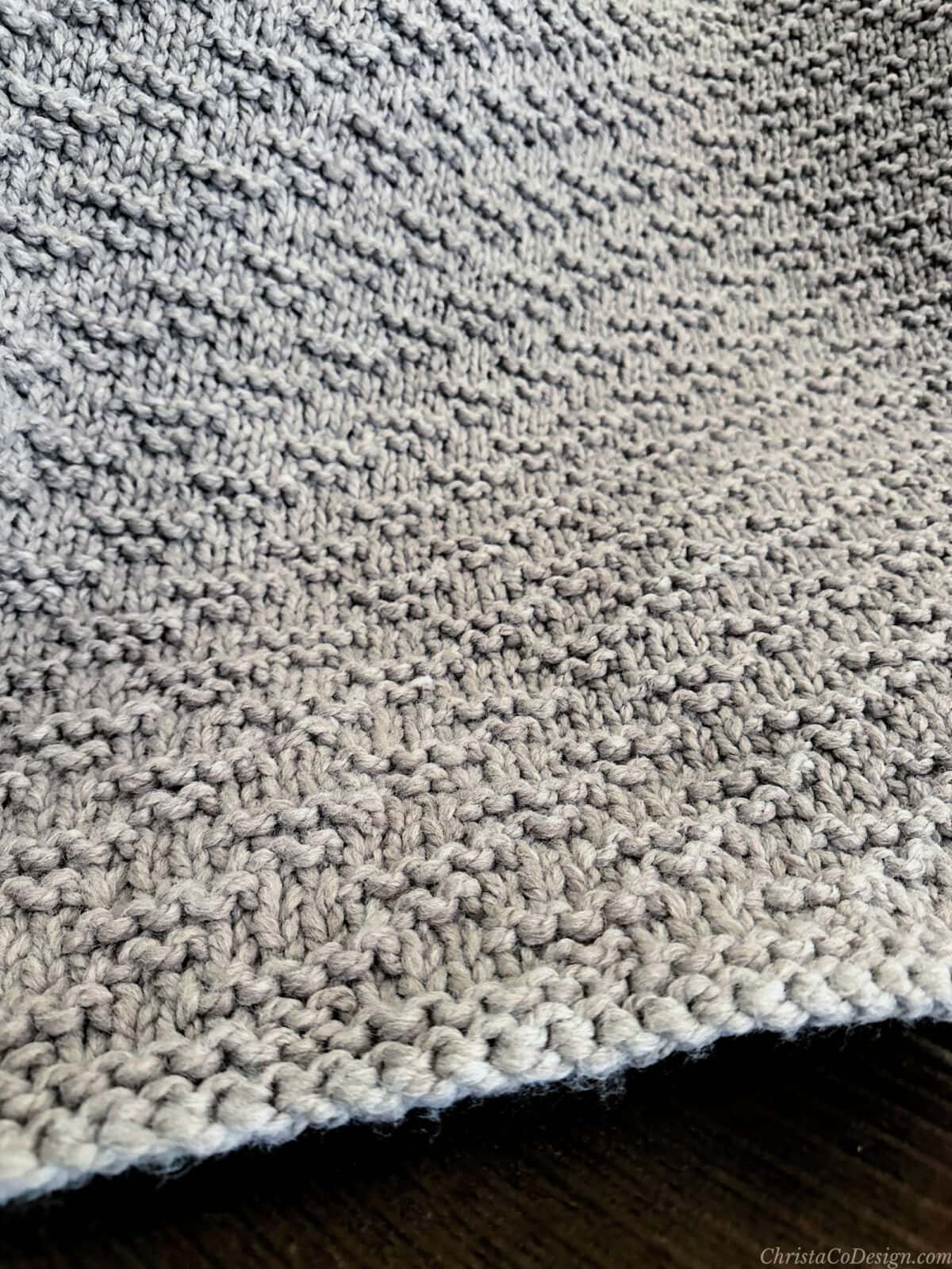 Close up of textured on knit blanket.