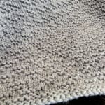 Close up of textured on knit blanket.