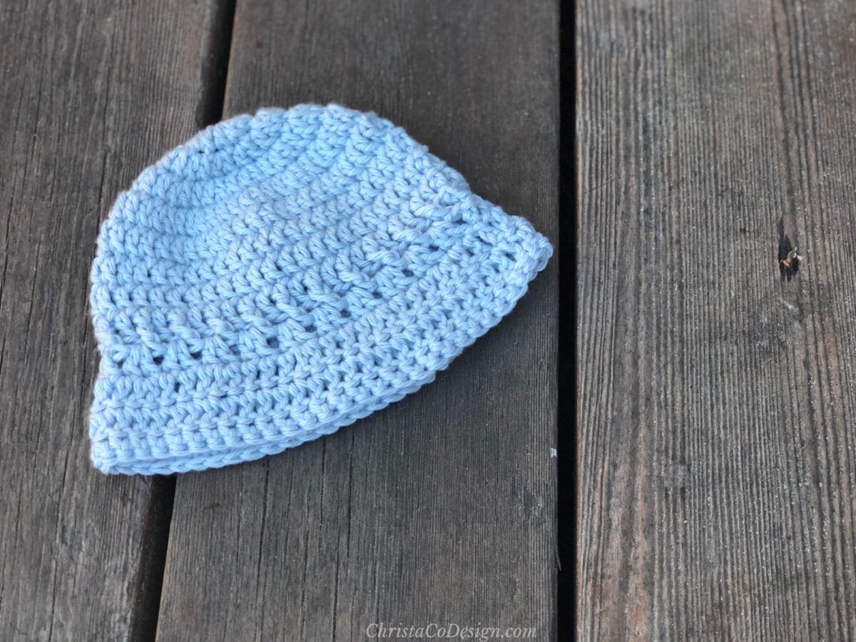 Blue baby sun hat laid flat.