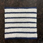 Blue and white striped dishcloth square.