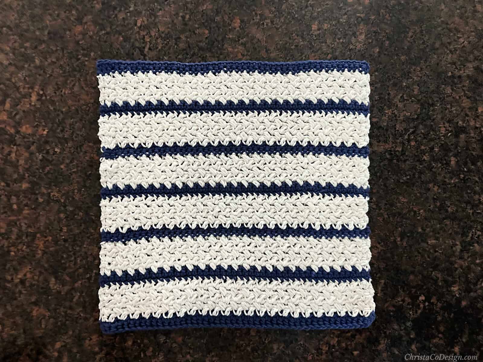 Blue and white striped dishcloth square.