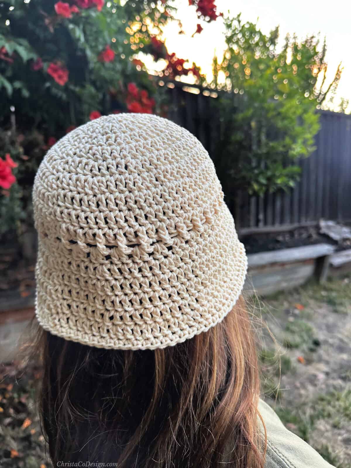 Back view of ecru cotton crochet hat.