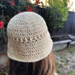 Back view of ecru cotton crochet hat.