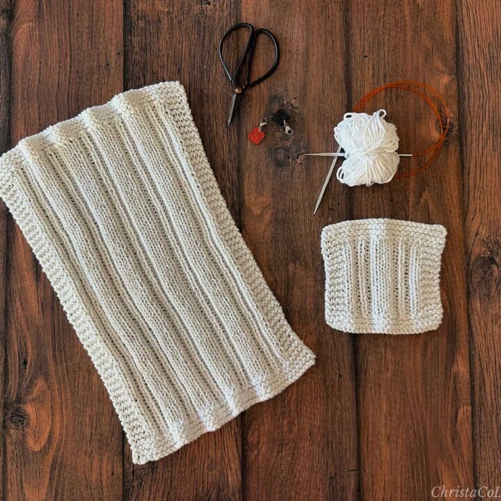White knit dishcloth with notions.