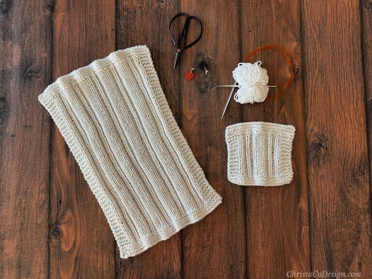 White knit dishcloth with notions.