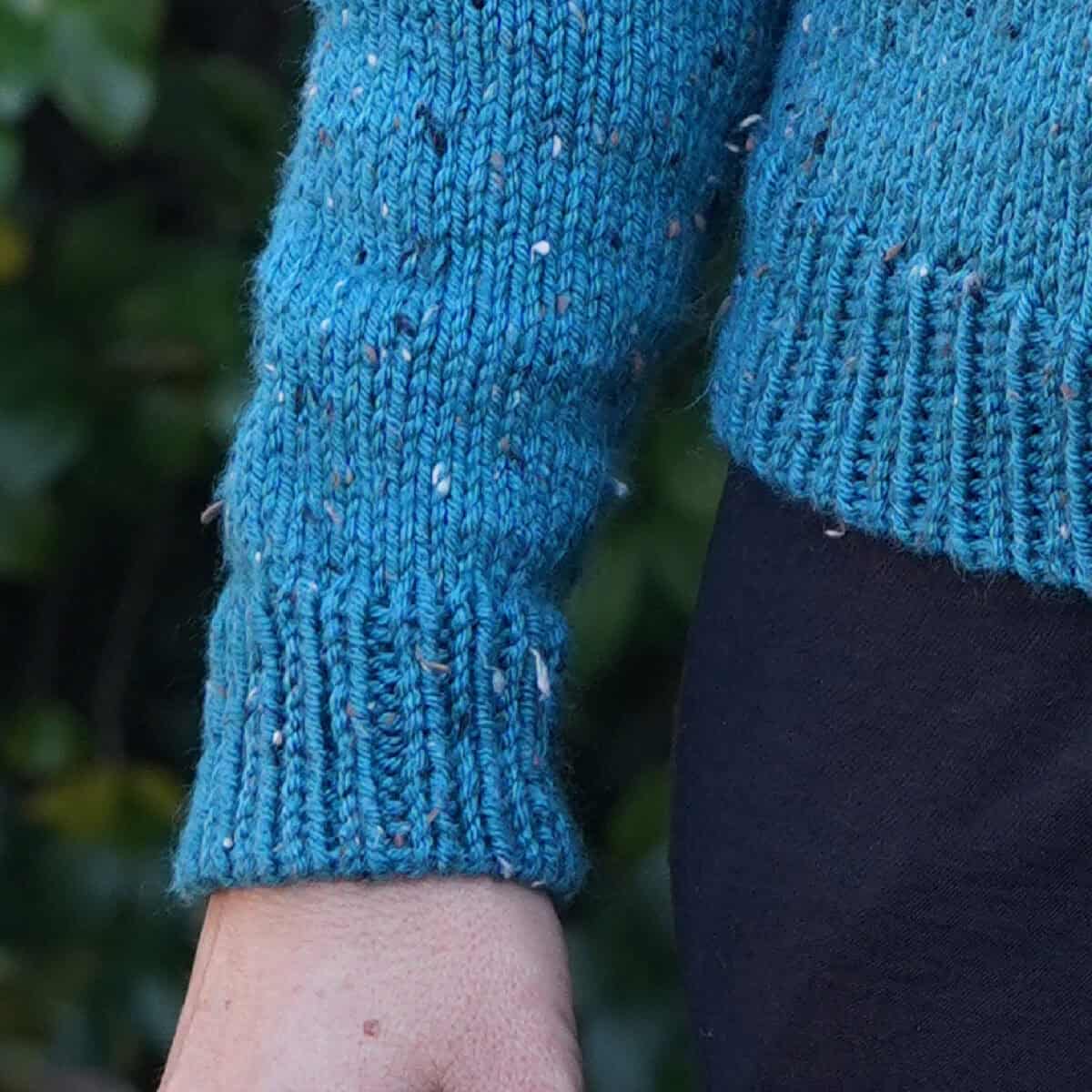 Ribbing on cuff and sweater hem.
