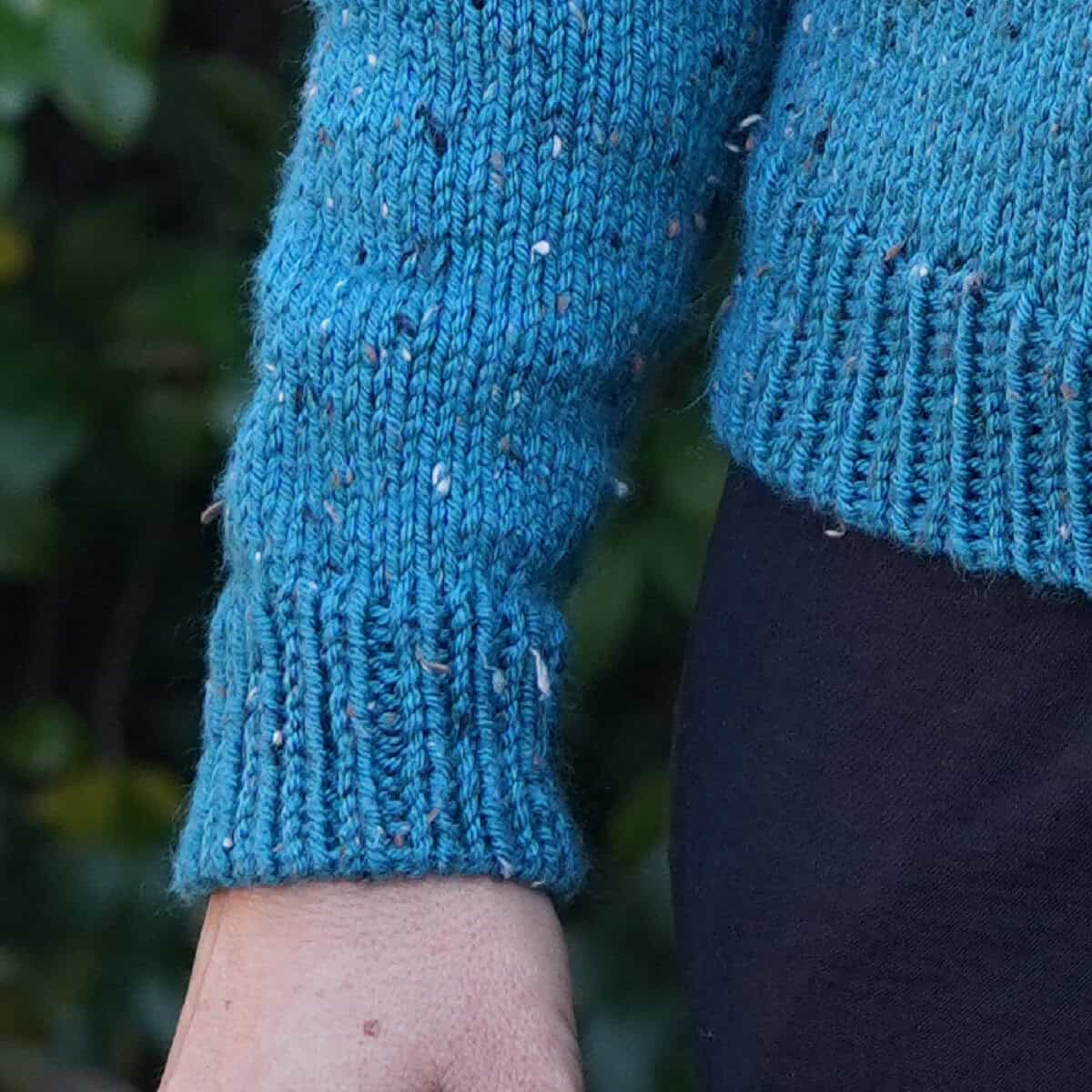 Ribbing on cuff and sweater hem.