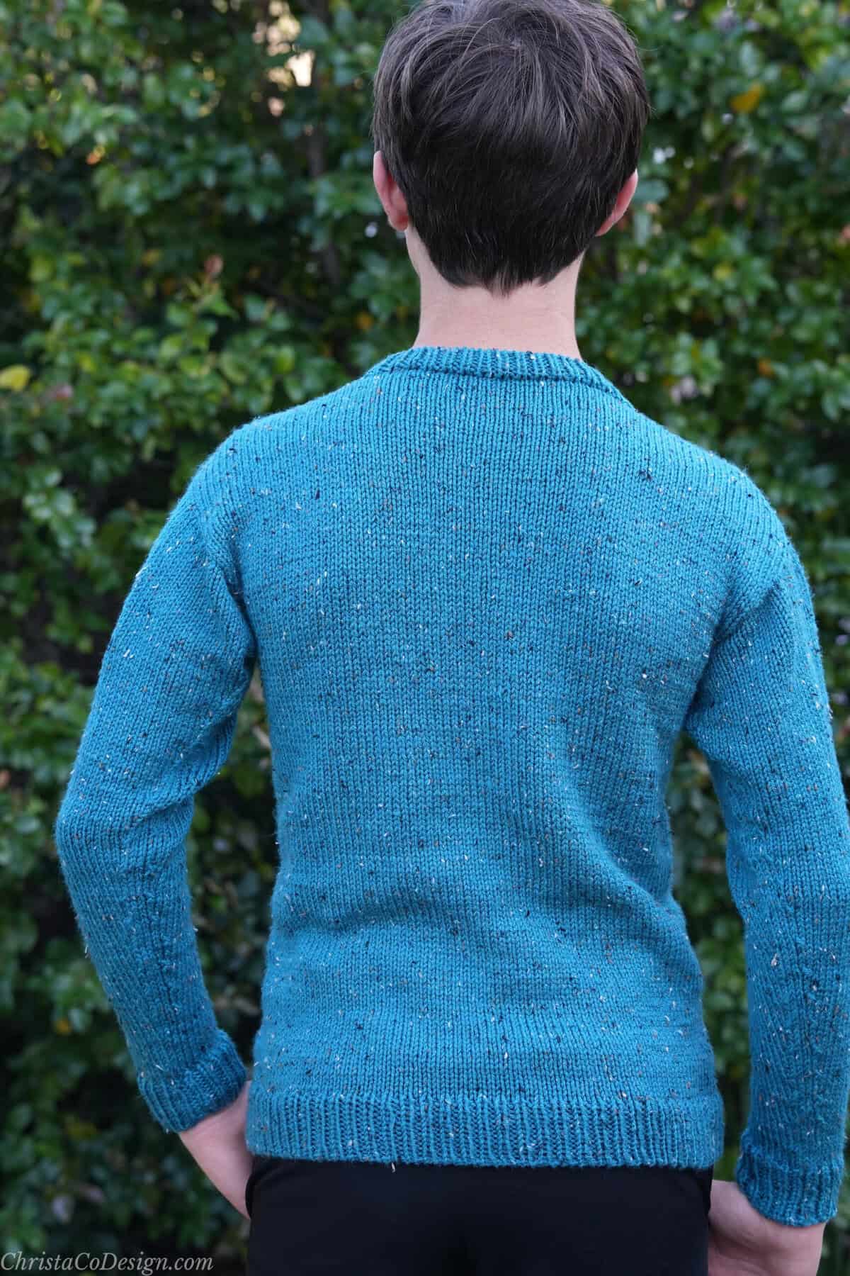 Back view of knit blue tweed sweater.