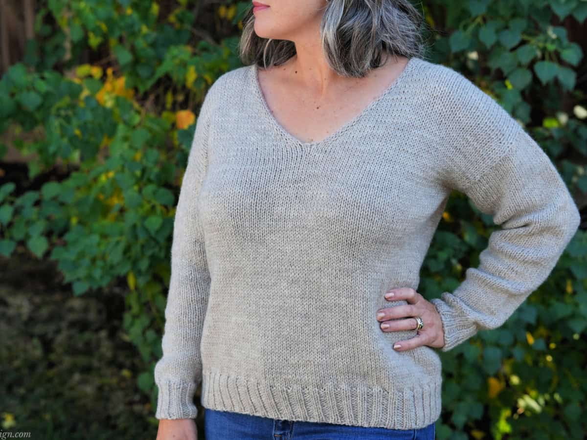 Woman in knit sweater.