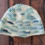 Single crochet hat in blue white changing yarn.