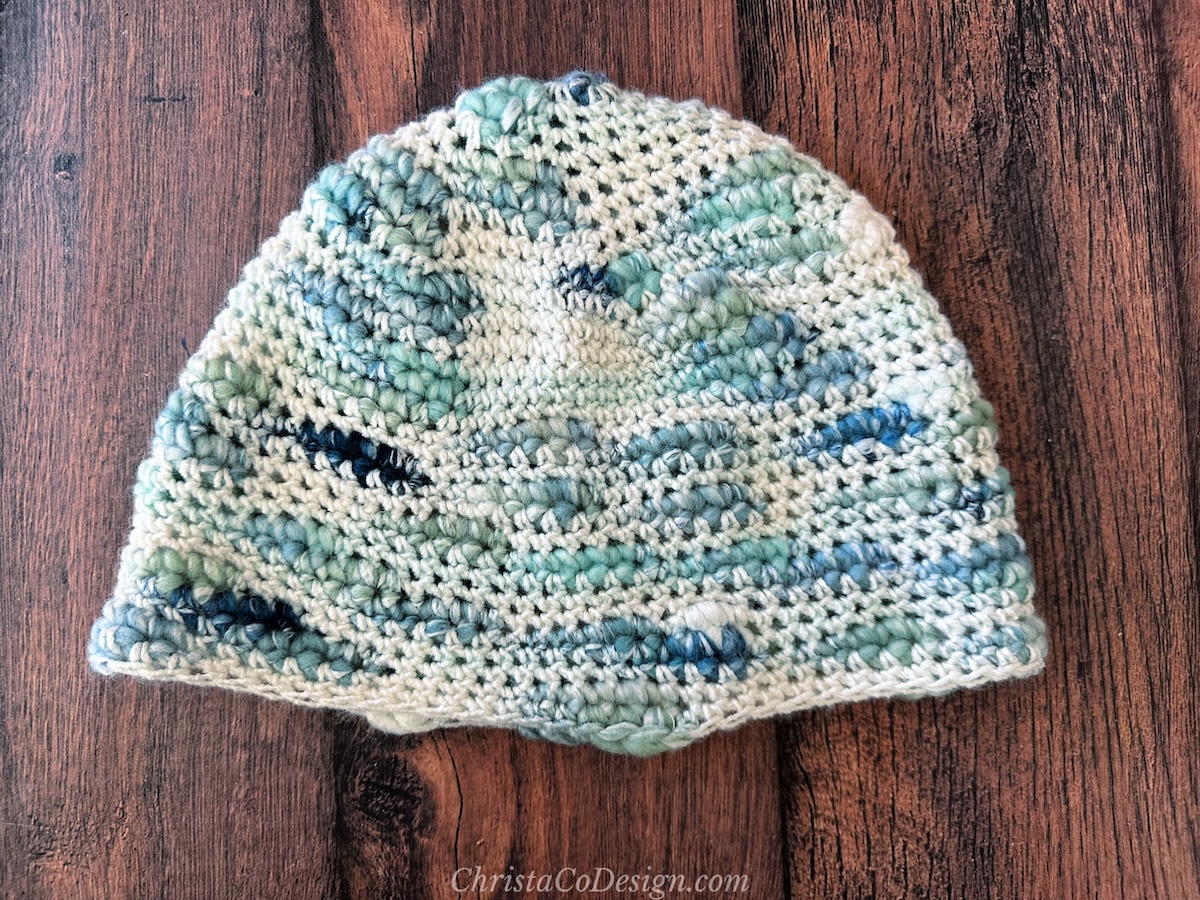 Single crochet hat in blue white changing yarn.